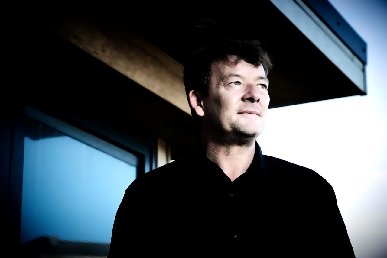 A photo of David Irvine looking out across his property.